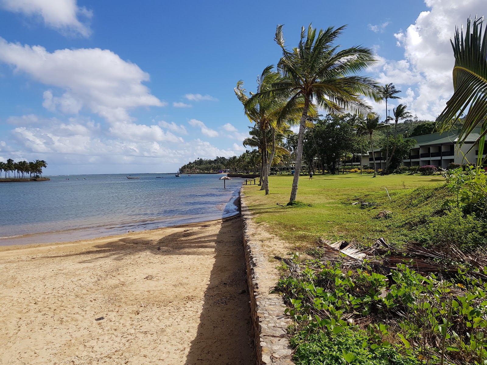Foto di Naviti Beach con una superficie del sabbia beige