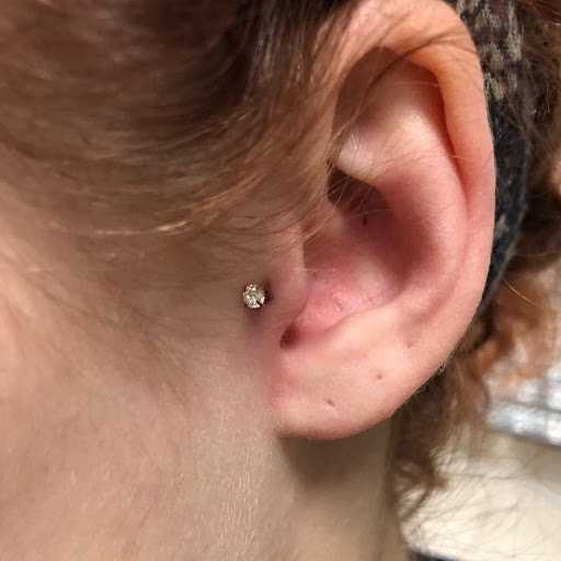 Explore statue tattoo ideas, creative tattoo ideas in Charleston, available at Exotic Impressions Body Piercing