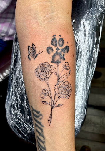 Explore women's arm tattoo ideas, creative tattoo ideas in Clarksville, available at Dark Raine Tattoo