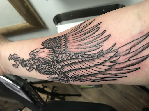 Explore fine line spine tattoo ideas, creative tattoo ideas in Jackson, available at Zero Regrets Tattoo and Piercing