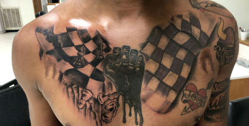 Explore neck tattoo ideas men, creative tattoo ideas in Eden, available at R1sk Takers Ink Tattoo and Piercing Lounge