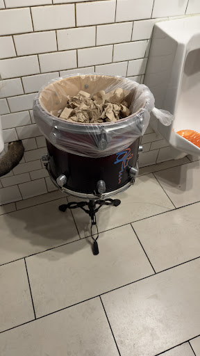 Tom trash can in men’s restroom 