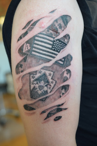 Tattoo Shop «The Shop», reviews and photos, 141 S Grand Ave, Fowlerville, MI 48836, USA