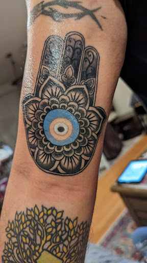 Explore half heart tattoo ideas, creative tattoo ideas in Philadelphia, available at Floating World Tattoos and Body Piercing