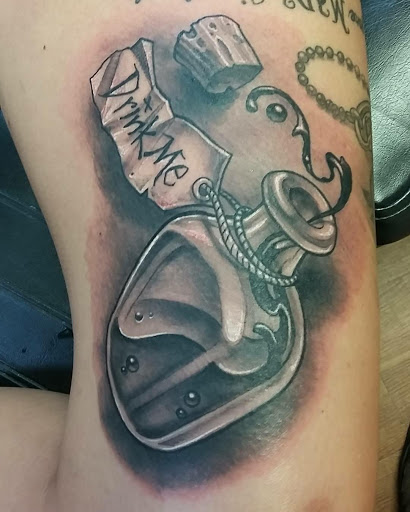 Tattoo Shop «Crossbones Tattoo & Piercings», reviews and photos, 19051 San Carlos Blvd #10, Fort Myers Beach, FL 33931, USA