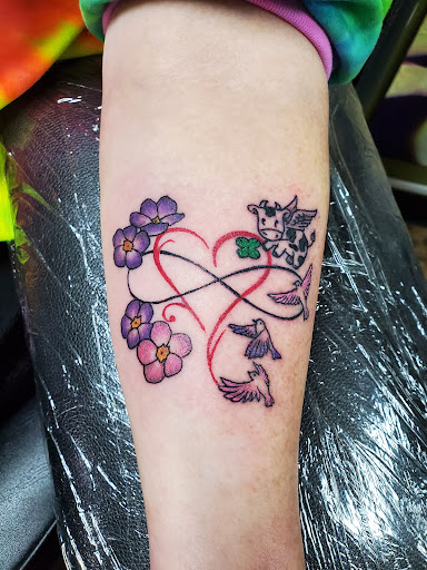 Explore flower leg tattoo ideas, creative tattoo ideas in Minneapolis, available at Captive Elements