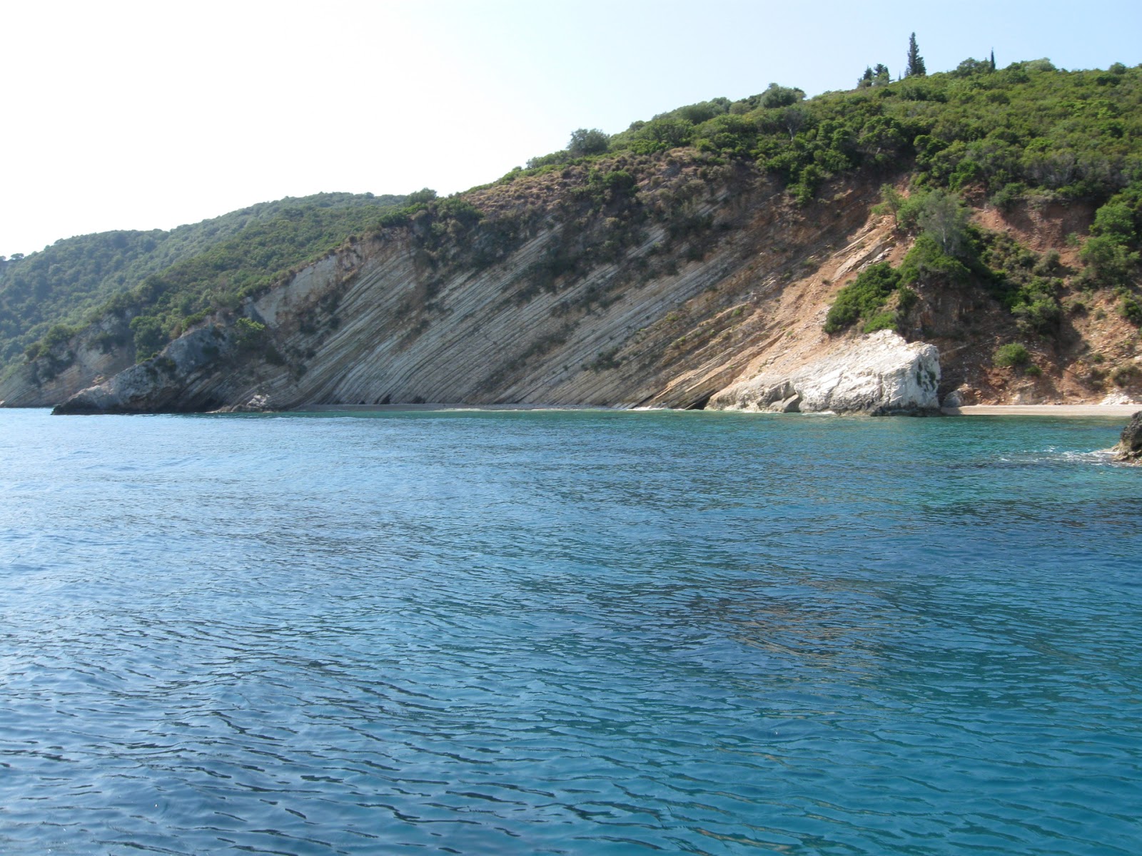 Foto van Skinos Bay IV met turquoise puur water oppervlakte