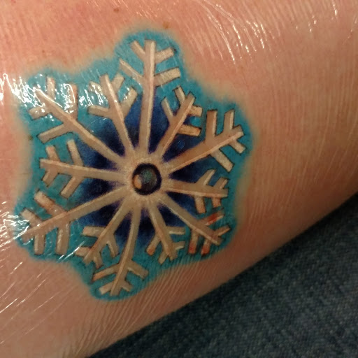 Explore middle finger tattoo ideas, creative tattoo ideas in Cicero, available at Serenity Tattoo