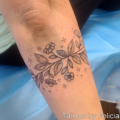 Explore cross forearm tattoo ideas, creative tattoo ideas in Fort Myers, available at Tiger Lotus Tattoo and Piercing