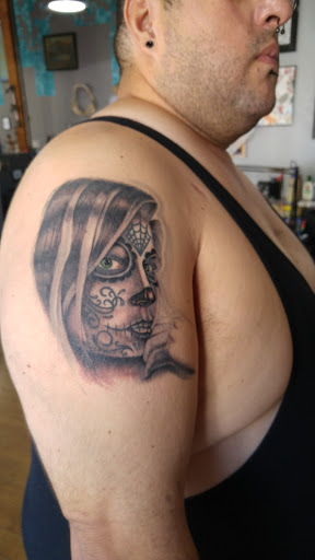 Explore blue rose tattoo ideas, creative tattoo ideas in San Diego, available at Vivid Tattoo