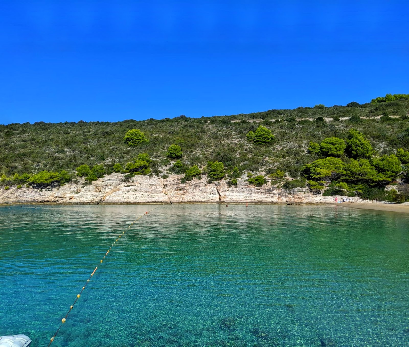 Foto di Porat beach con baia piccola