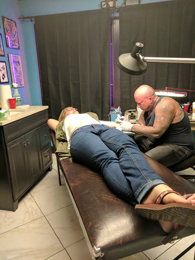 Explore ribbon tattoo ideas, creative tattoo ideas in Garland, available at Fine Line Tattoos