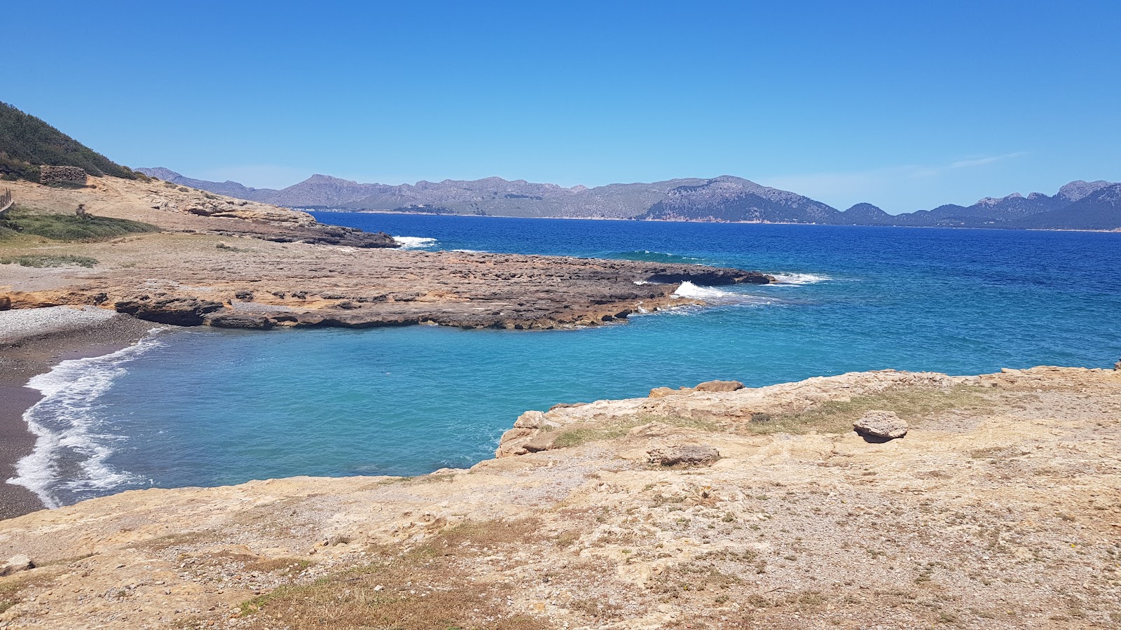 Playa La Victoria'in fotoğrafı düz bir kıyı şeridi ile birlikte