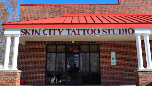 Find tattoo ideas for in between breast for your next unique tattoo in Monroe at Skin City Tattoo Studio