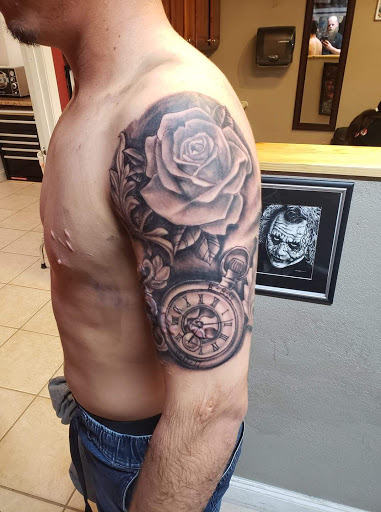 Explore hand tattoos for men ideas, creative tattoo ideas in Ocoee, available at Slaughterized Ink Tattoo and Piercing Studio