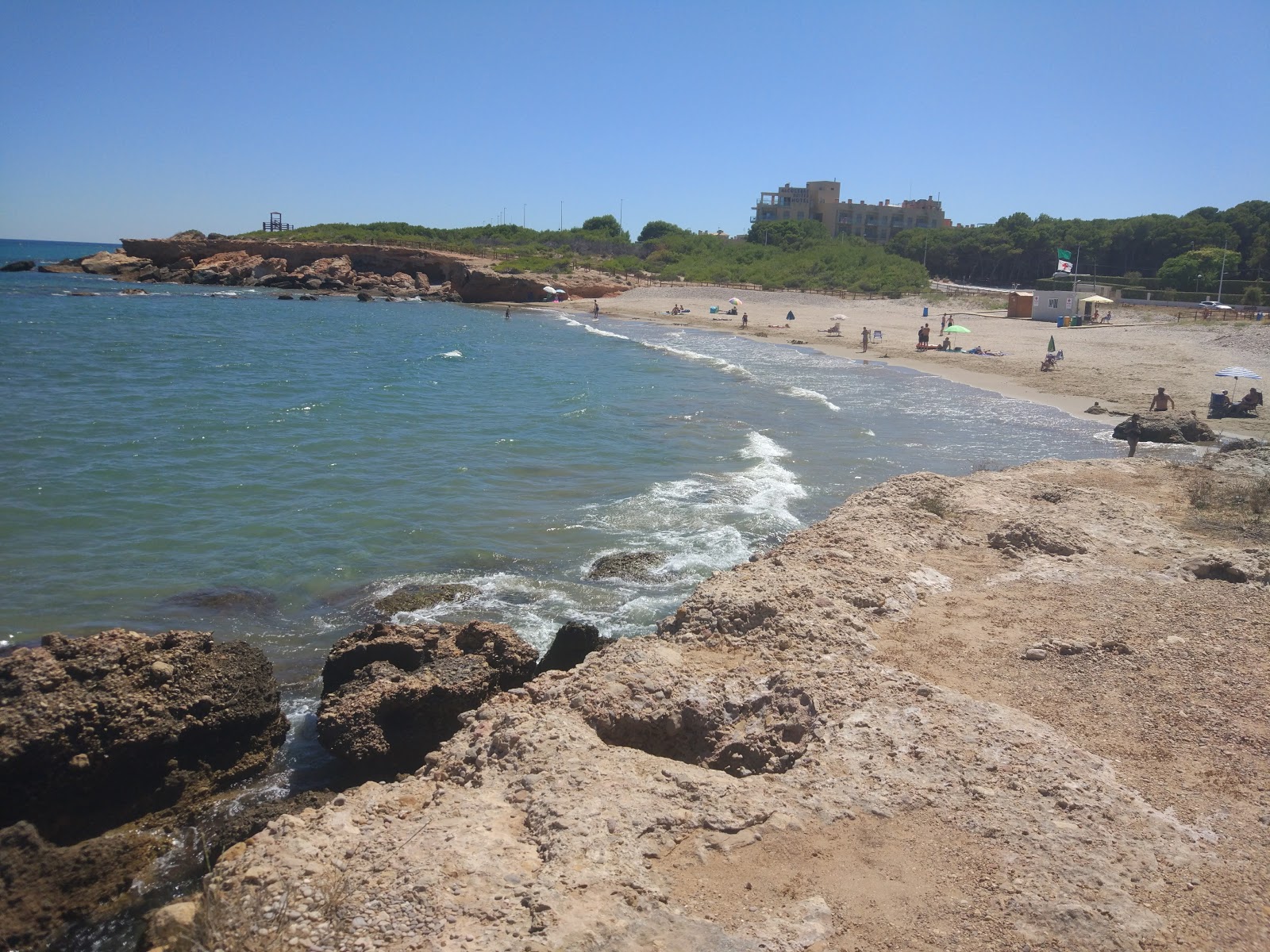 Foto van Playa del Moro met bruin zand oppervlakte