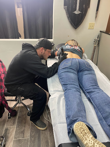 Explore guitar pick tattoo ideas, creative tattoo ideas in Pineville, available at Twin Flame Tattoo & Skincare