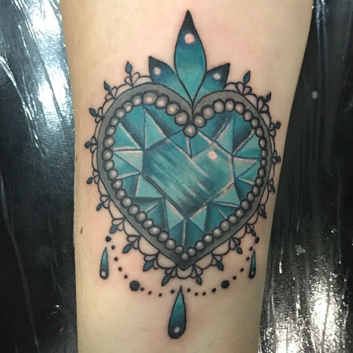 Explore chevy bowtie tattoo ideas, creative tattoo ideas in Bronx, available at Tattoo Kingdom