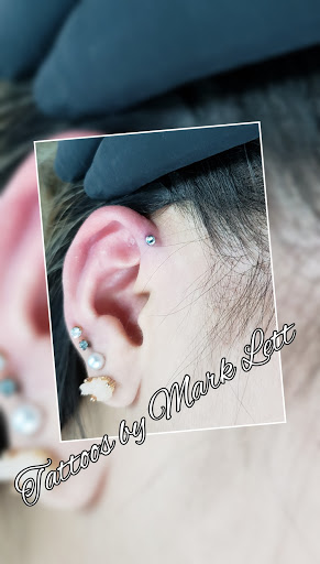 Explore batman tattoo ideas, creative tattoo ideas in Saint Petersburg, available at Edens Apple Tattoos and Piercings