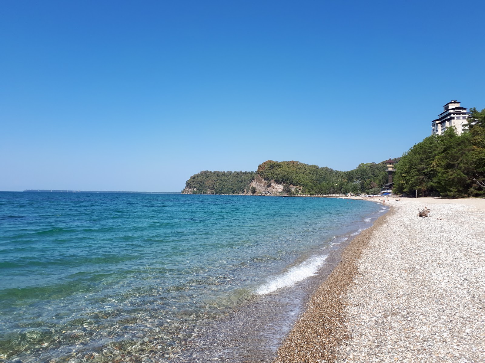 Foto de Miussera beach con arena beige y guijarros superficie