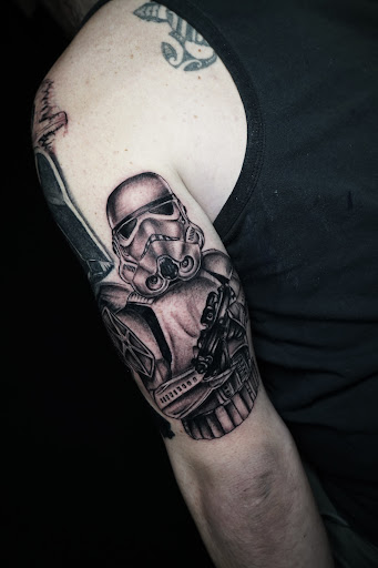Explore back of the ear tattoo ideas, creative tattoo ideas in New York, available at Red Baron Ink Tattoo and Piercing