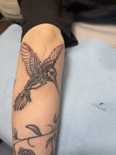 Explore under breast tattoo ideas for females, creative tattoo ideas in Butler, available at Kryptic Skin Tattoo