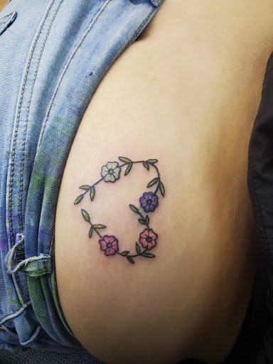 Explore genesis tattoo ideas, creative tattoo ideas in Cocoa, available at Rorschach Tattoo Shop and Piercing Studio