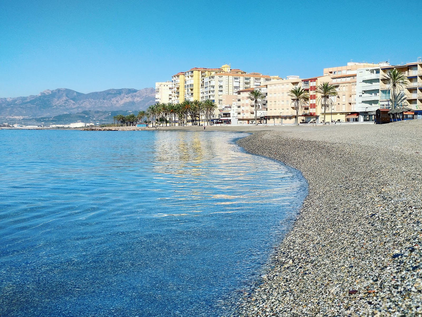 Foto af Playa de Torrenueva Costa med blåt rent vand overflade
