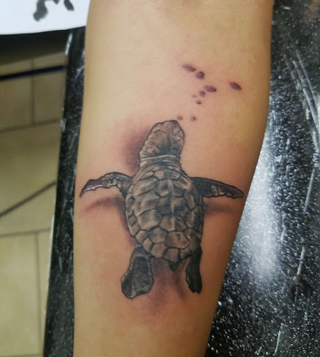 Tattoo Shop «magnum opus tattoo company», reviews and photos, 1817 Padre Blvd #4, South Padre Island, TX 78597, USA