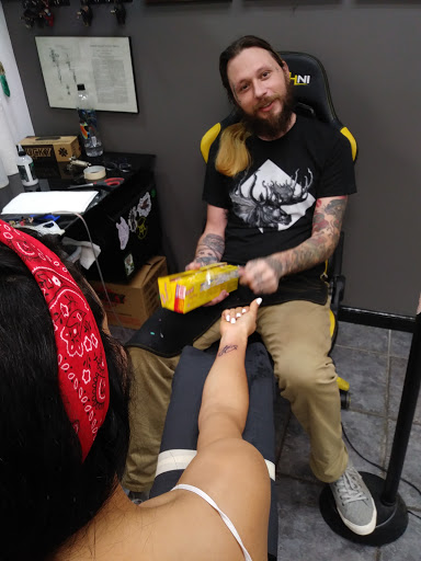 Explore tramp stamp tattoo ideas, creative tattoo ideas in Ocala, available at Cobra Classic Tattoo