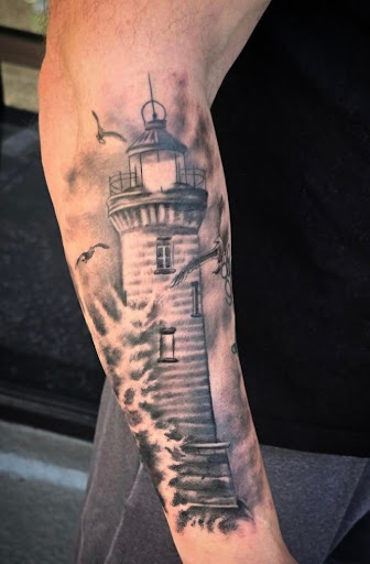 Explore back arm tattoo ideas for guys, creative tattoo ideas in Navarre, available at Eleven 11 Tattoo Studio