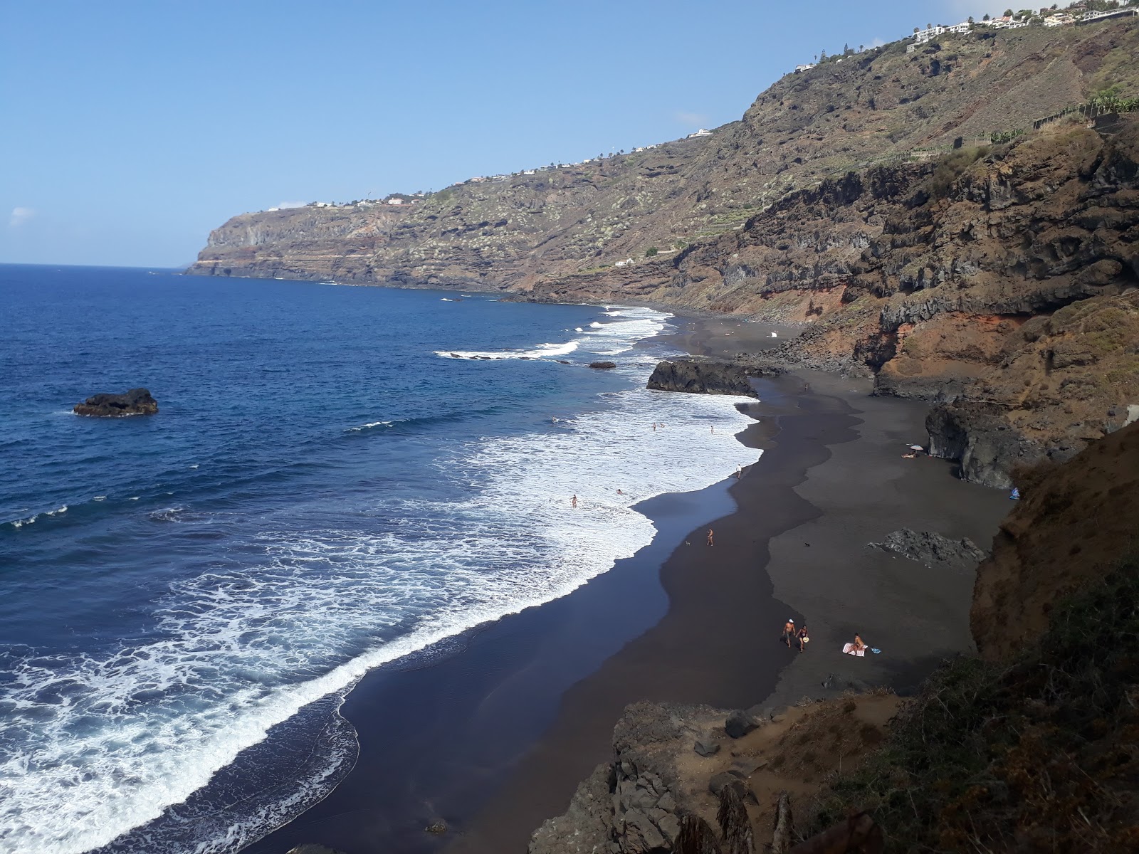 Fotografie cu Playa Los Patos cu o suprafață de nisip fin gri