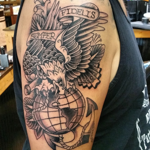 Explore military dog tag tattoo ideas, creative tattoo ideas in Fort Smith, available at Hanging City Body Modification