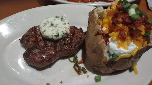 Steak and baked potatoe.