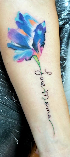 Find between the breast tattoo ideas for your next unique tattoo in Benton at Spectrum Tattoo