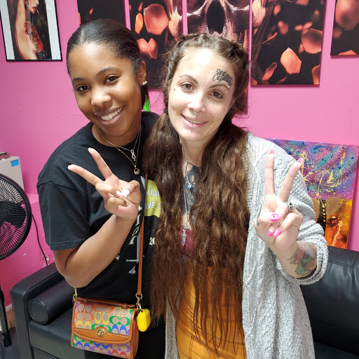 Explore hand and finger tattoo ideas, creative tattoo ideas in Ocoee, available at Slaughterized Ink Tattoo and Piercing Studio