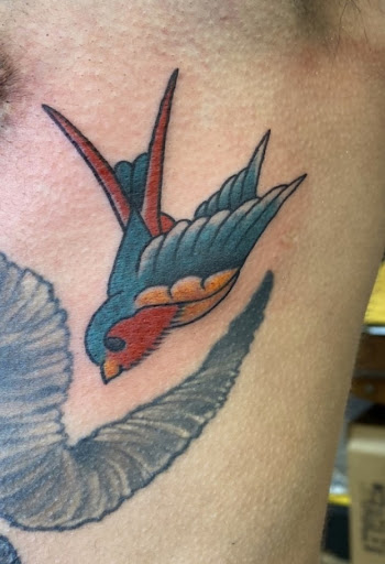 Explore upper back tattoo ideas for guys, creative tattoo ideas in Baltimore, available at Rippd Canvas Tattoo Shop Artists Social Club