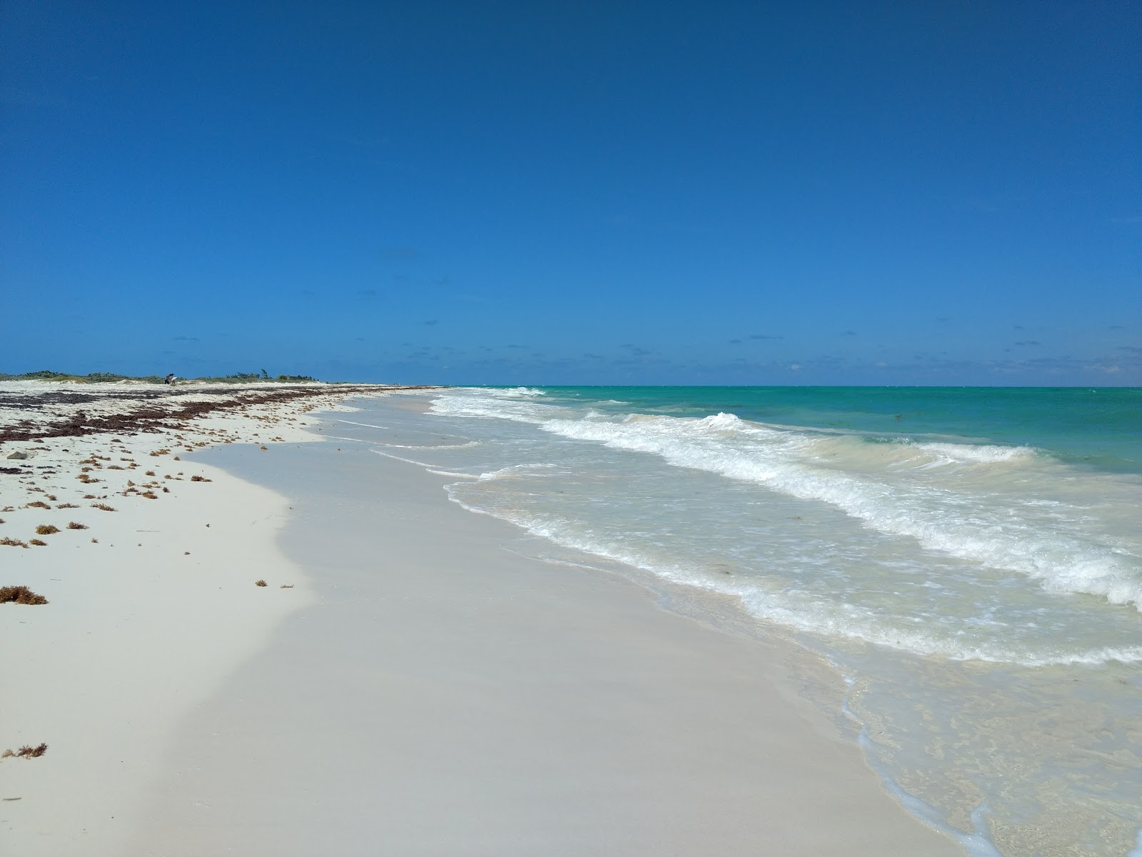 Fotografie cu Isla Blanca cu o suprafață de nisip fin strălucitor