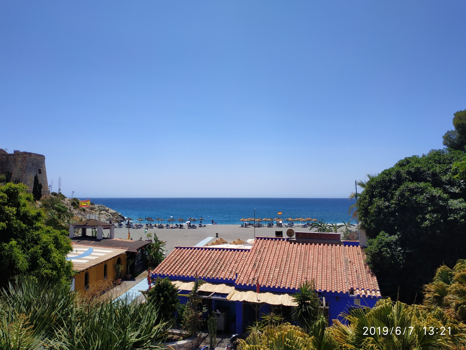 Foto af Playa de Velilla med blåt rent vand overflade
