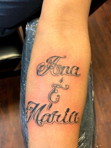 Find arm band tattoo ideas for your next unique tattoo in Seymour at American Gypsy Tattoo Corp.