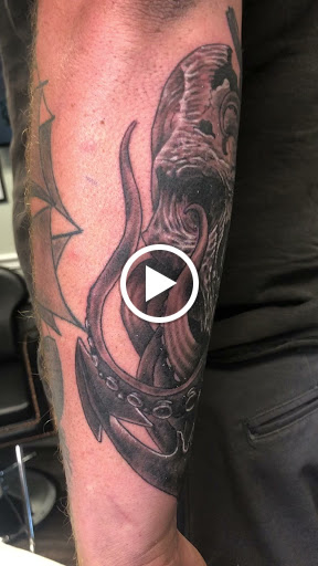 Explore cupid tattoo ideas, creative tattoo ideas in Englewood, available at Point of Entry Tattoo