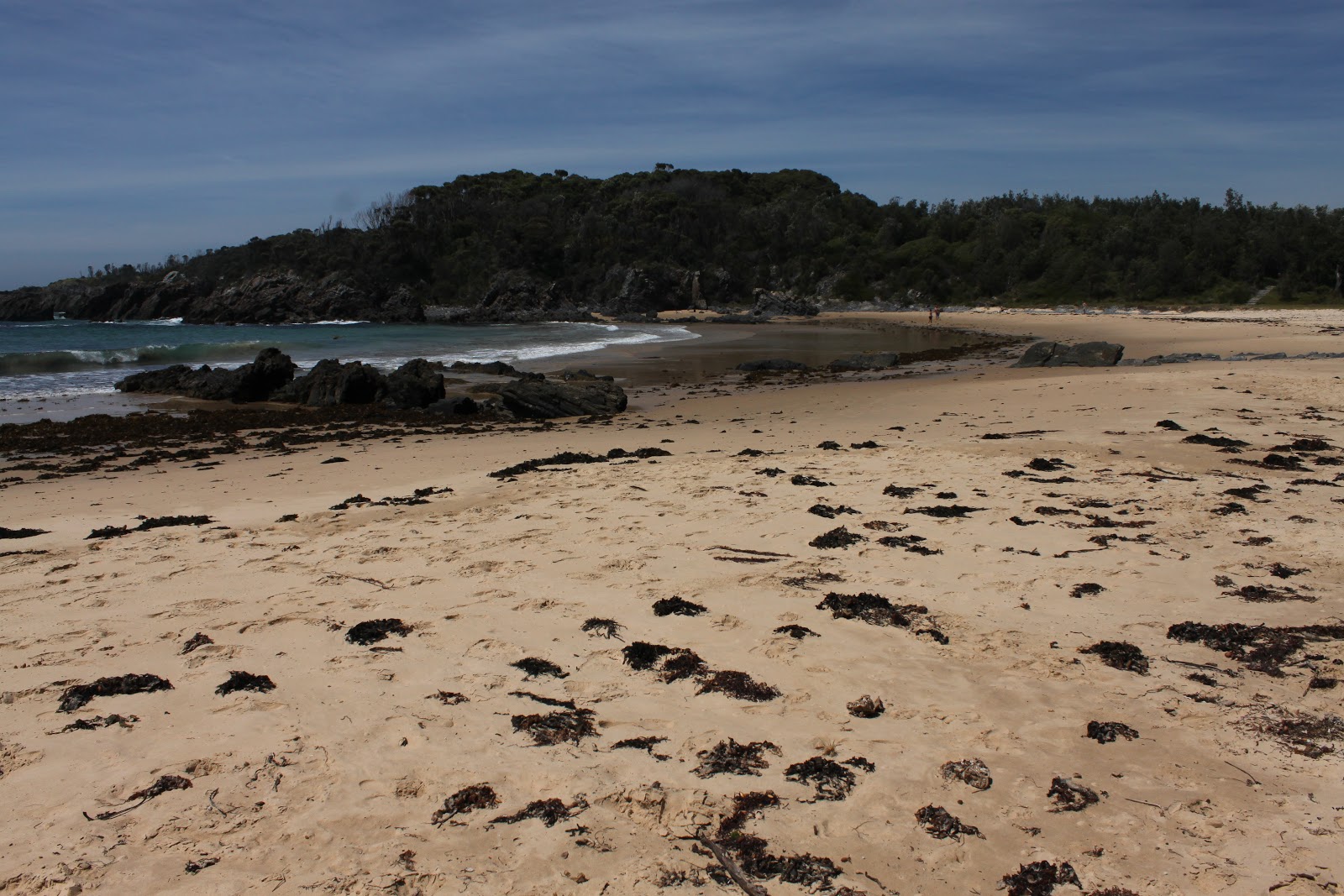 Foto van Mystery Beach met helder zand oppervlakte