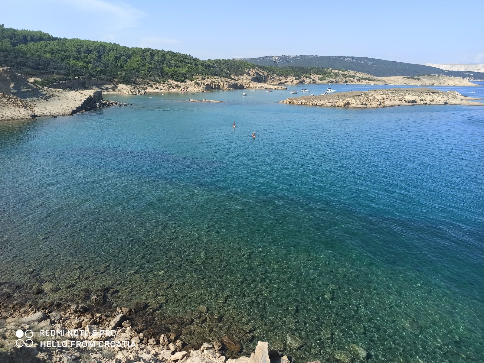 Foto von Stolac beach mit türkisfarbenes wasser Oberfläche