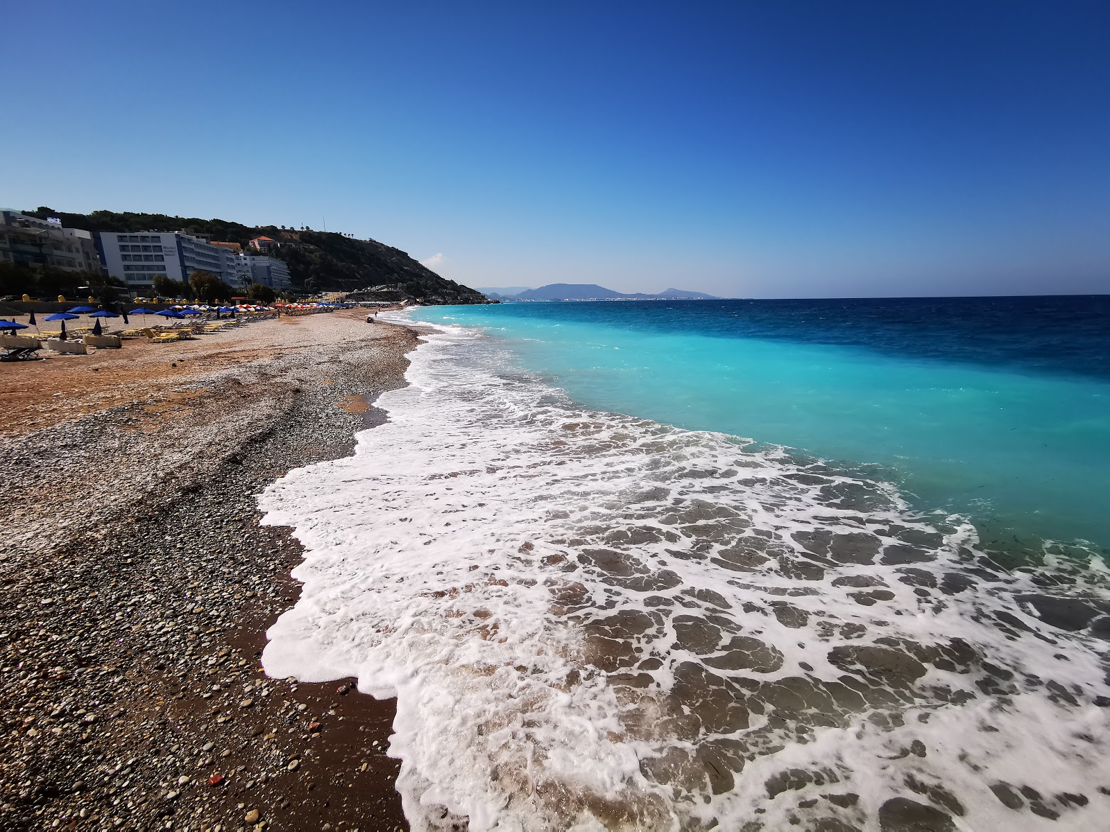 Foto van Niohori Beach met blauw puur water oppervlakte