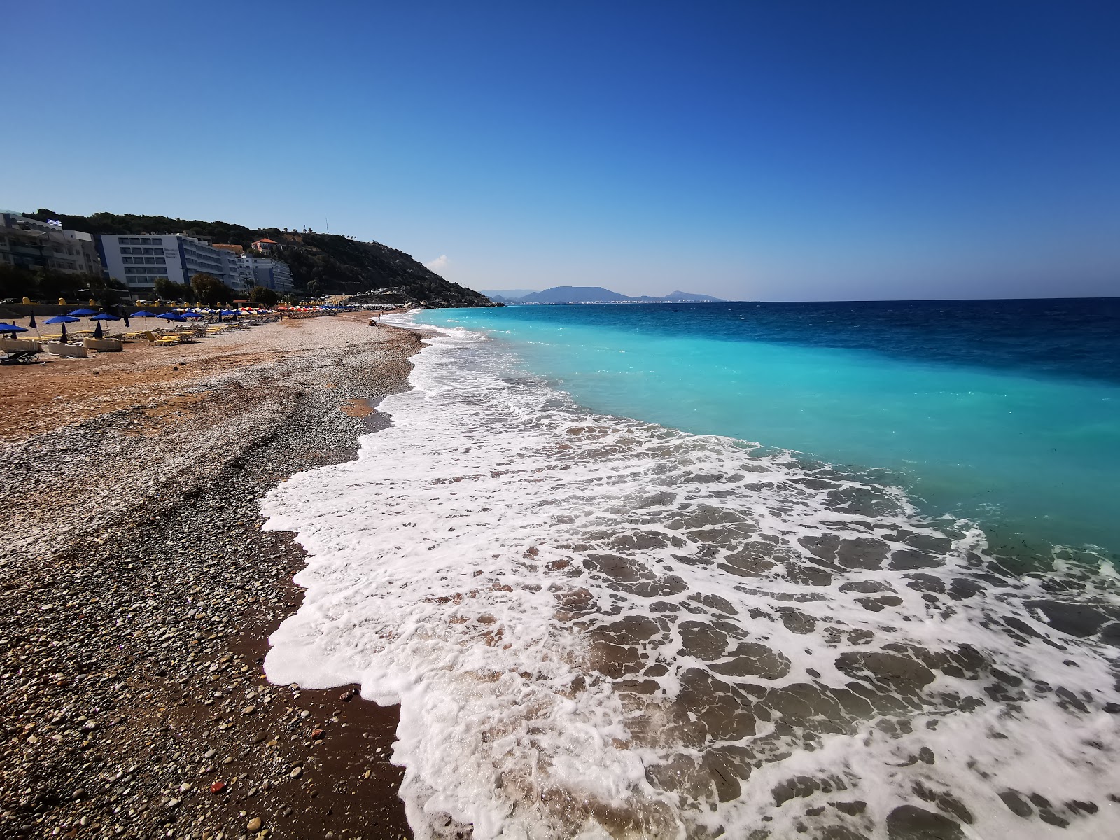 Fotografija Niohori Beach z modra čista voda površino