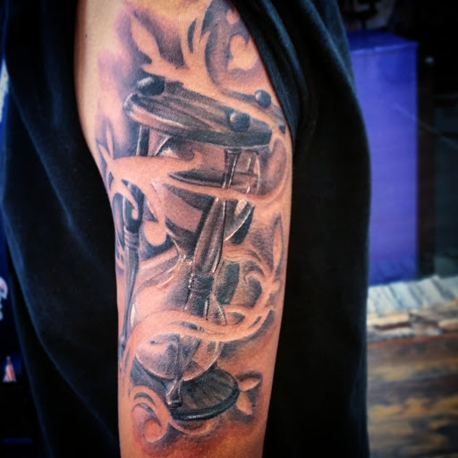 Explore half sleeve tattoo ideas for men with meaning, creative tattoo ideas in El Paso, available at House of Pain Tattoo & Body Piercing Studios