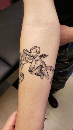 Explore tattoo ideas on rib cage, creative tattoo ideas in Milwaukee, available at Bay Street Tattoo Co.