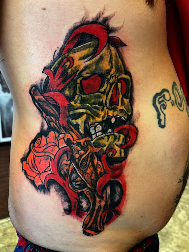 Find background tattoo ideas for guys for your next unique tattoo in Seymour at American Gypsy Tattoo Corp.