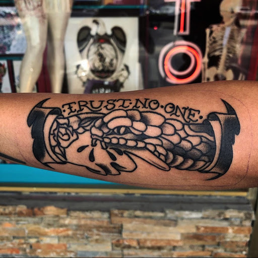 Explore tattoo ideas for football, creative tattoo ideas in Fort Lauderdale, available at Electric Street Tattoo