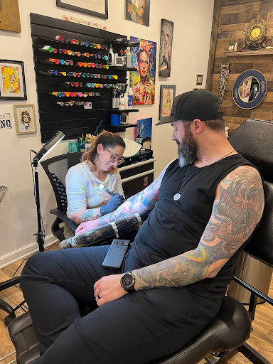 Explore women's hand tattoo ideas, creative tattoo ideas in Bethpage, available at Village Tattoo